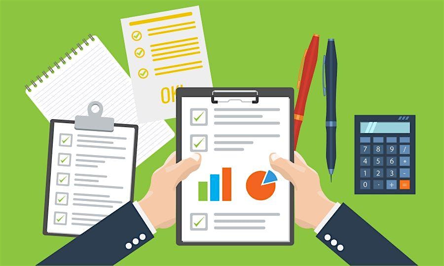 Person holding a tablet with charts and checklists, surrounded by notebooks, pens, and a calculator for business planning.